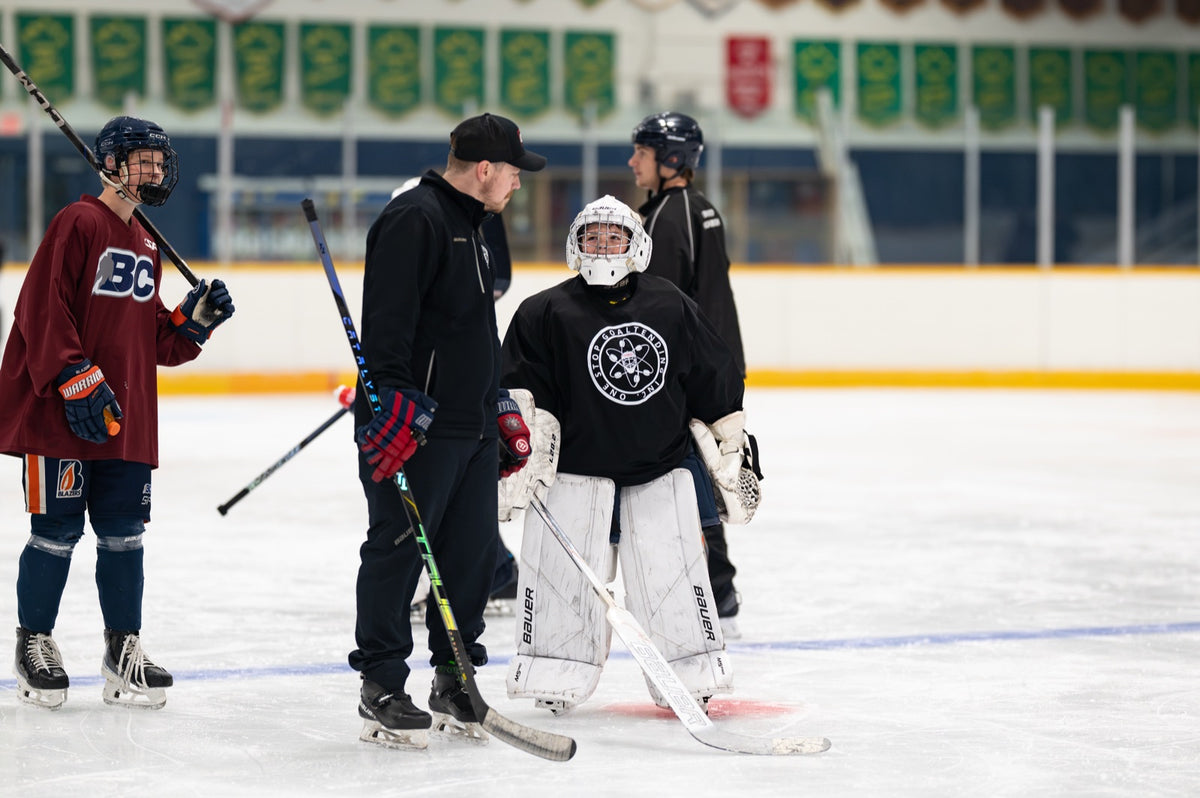 One Stop Goaltending coach working with a goalie
